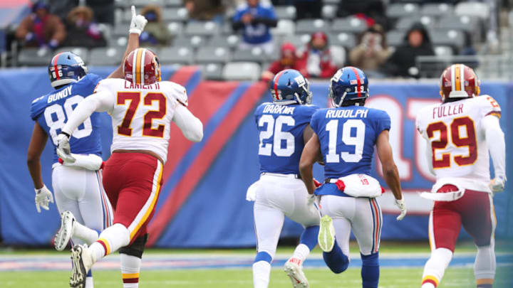 EAST RUTHERFORD, NJ - DECEMBER 31: Orleans Darkwa #26 of the New York Giants runs for a touchdown during the first quarter of their game against the Washington Redskins at MetLife Stadium on December 31, 2017 in East Rutherford, New Jersey. (Photo by Ed Mulholland/Getty Images)