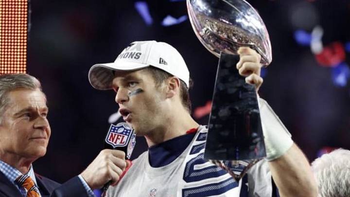 Feb 1, 2015; Glendale, AZ, USA; New England Patriots quarterback Tom Brady (12) celebrates with the Vince Lombardi Trophy after beating the Seattle Seahawks in Super Bowl XLIX at University of Phoenix Stadium. Mandatory Credit: Matthew Emmons-USA TODAY Sports