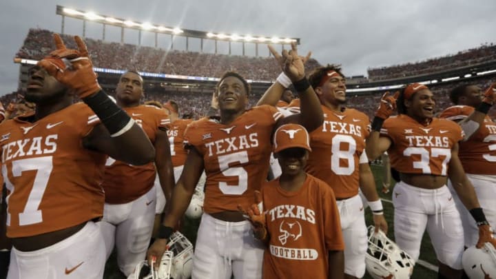 AUSTIN, TX - SEPTEMBER 22: Tre Watson #5 of the Texas Longhorns celebrates with teammates after the game against the TCU Horned Frogs at Darrell K Royal-Texas Memorial Stadium on September 22, 2018 in Austin, Texas. (Photo by Tim Warner/Getty Images)