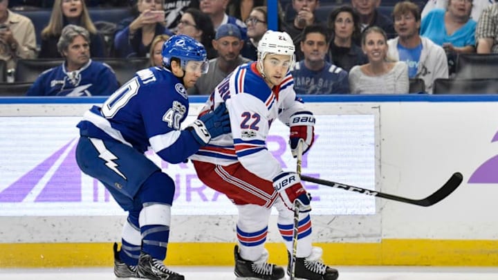 TAMPA, FL - NOVEMBER 02: New York Rangers defender Kevin Shattenkirk (22) is closely defended by Tampa Bay Lightning center Gabriel Dumont (40) during the first period of an NHL game between the New York Rangers and the Tampa Bay Lightning on November 02, 2017 at Amalie Arena in Tampa, FL. (Photo by Roy K. Miller/Icon Sportswire via Getty Images)