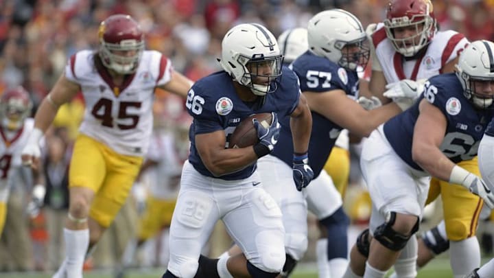 January 2, 2017; Pasadena, CA, USA; Penn State Nittany Lions running back Saquon Barkley (26) runs the ball against the Southern California Trojans during the first half of the 2017 Rose Bowl game at the Rose Bowl. Mandatory Credit: Gary A. Vasquez-USA TODAY Sports