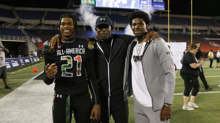 Jan 3, 2019; Orlando, FL, USA; Team Ballaholics head coach Deion Sanders poses with his son defensive back Shilo Sanders (21) at Camping World Stadium. Mandatory Credit: Kim Klement-USA TODAY Sports