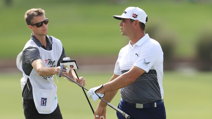 PALM BEACH GARDENS, FLORIDA – MARCH 01: Gary Woodland talks with his caddie before playing his second shot on the ninth hole during the second round of the Honda Classic at PGA National Resort and Spa on March 01, 2019 in Palm Beach Gardens, Florida. (Photo by Sam Greenwood/Getty Images)