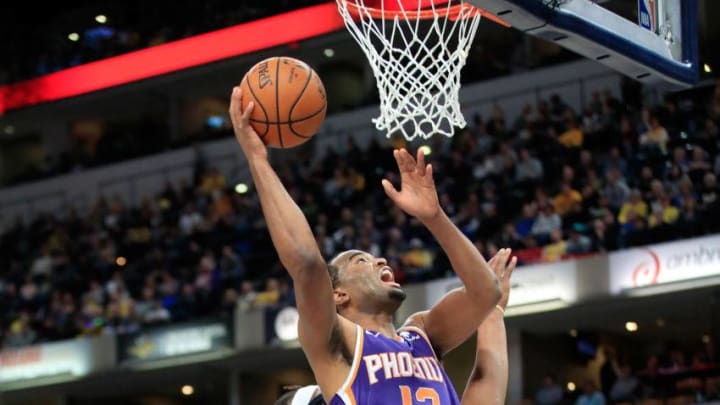 INDIANAPOLIS, IN - JANUARY 15: T.J. Warren #12 of the Phoenix Suns shoots the ball against the Indiana Pacersat Bankers Life Fieldhouse on January 15, 2019 in Indianapolis, Indiana. NOTE TO USER: User expressly acknowledges and agrees that, by downloading and or using this photograph, User is consenting to the terms and conditions of the Getty Images License Agreement. (Photo by Andy Lyons/Getty Images)