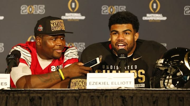 Jan 12, 2015; Arlington, TX, USA; Ohio State Buckeyes quarterback Cardale Jones (12) talks with running back Ezekiel Elliott (15) during a press conference after beating the Oregon Ducks in the 2015 CFP National Championship Game at AT&T Stadium. Mandatory Credit: Tim Heitman-USA TODAY Sports