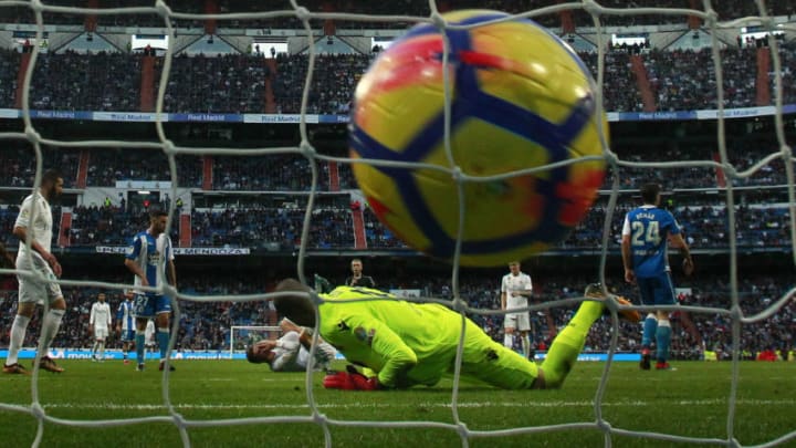 MADRID, SPAIN - JANUARY 21: Cristiano Ronaldo of Real Madrid CF falls to the ground after scoring their sixth goal during the La Liga match between Real Madrid CF and Deportivo La Coruna at Estadio Santiago Bernabeu on January 21, 2018 in Madrid, Spain. (Photo by Gonzalo Arroyo Moreno/Getty Images)