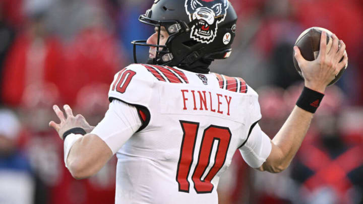 Nov 19, 2022; Louisville, Kentucky, USA; North Carolina State Wolfpack quarterback Ben Finley (10) looks to pass against the Louisville Cardinals during the second quarter at Cardinal Stadium. Louisville defeated North Carolina State 25-10. Mandatory Credit: Jamie Rhodes-USA TODAY Sports