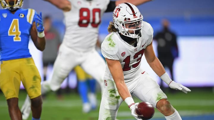 Dec 19, 2020; Pasadena, California, USA; Stanford Cardinal wide receiver Simi Fehoko (13) catches a touchdown pass from quarterback Davis Mills (15) in the second half of the game against the UCLA Bruins at the Rose Bowl. Mandatory Credit: Jayne Kamin-Oncea-USA TODAY Sports