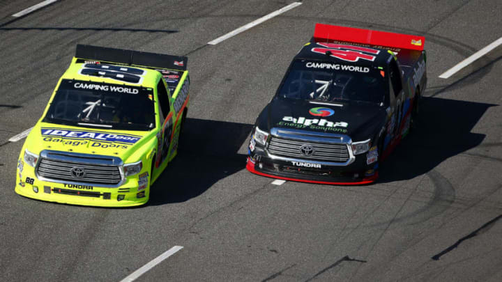 MARTINSVILLE, VA - APRIL 02: Matt Crafton, driver of the #88 Ideal Door/Menards Toyota, races Ben Rhodes, driver of the #41 Alpha Energy Solutions Toyota, during the NASCAR Camping World Truck Series Alpha Energy Solutions 250 at Martinsville Speedway on April 2, 2016 in Martinsville, Virginia. (Photo by Sarah Crabill/Getty Images)