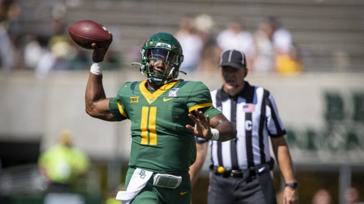 Oct 9, 2021; Waco, Texas, USA; Baylor Bears quarterback Gerry Bohanon (11) passes against the West Virginia Mountaineers during the second half at McLane Stadium. Mandatory Credit: Jerome Miron-USA TODAY Sports