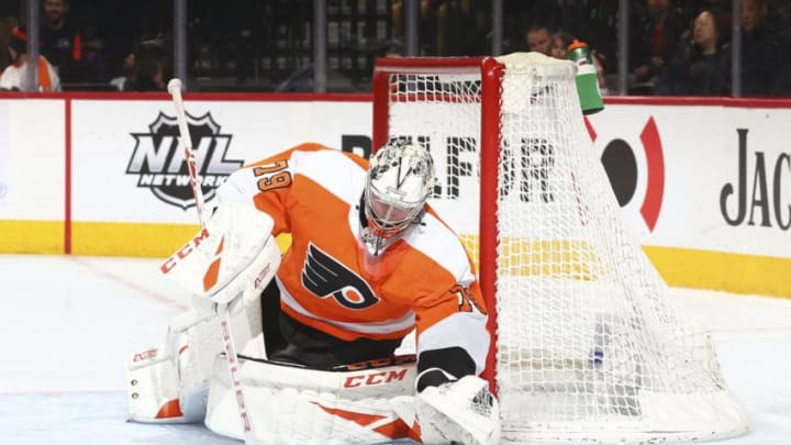 PHILADELPHIA, PA - FEBRUARY 22: Carter Hart #79 of the Philadelphia Flyers covers the puck against the Winnipeg Jets at the Wells Fargo Center on February 22, 2020 in Philadelphia, Pennsylvania. (Photo by Mitchell Leff/Getty Images)