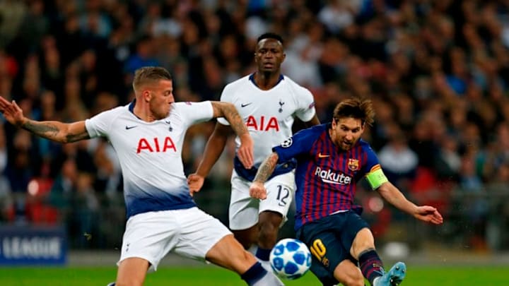 Barcelona's Argentinian striker Lionel Messi (R) shoots as Tottenham Hotspur's Belgian defender Toby Alderweireld (L) tries to block during the Champions League group B football match match between Tottenham Hotspur and Barcelona at Wembley Stadium in London, on October 3, 2018. (Photo by Ian KINGTON / IKIMAGES / AFP) (Photo credit should read IAN KINGTON/AFP/Getty Images)