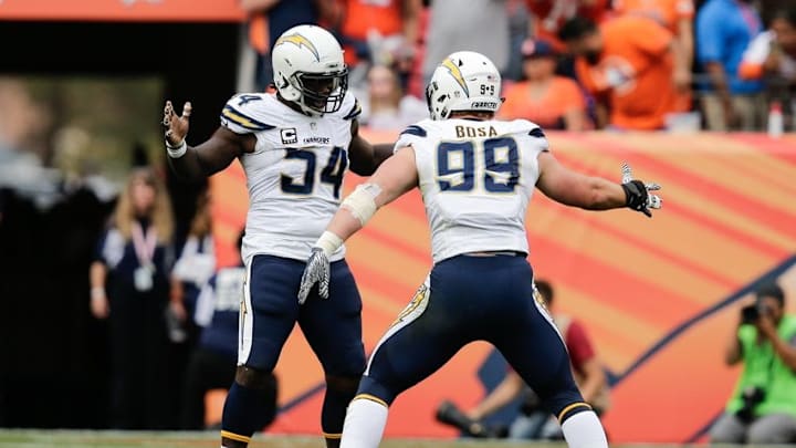Oct 30, 2016; Denver, CO, USA; San Diego Chargers outside linebacker Melvin Ingram (54) celebrates with defensive end Joey Bosa (99) after recovering a fumble in the third quarter against the Denver Broncos at Sports Authority Field at Mile High. The Broncos won 27-19. Mandatory Credit: Isaiah J. Downing-USA TODAY Sports