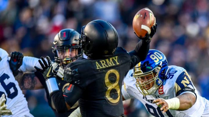 PHILADELPHIA, PA - DECEMBER 08: Navy Midshipmen defensive end Jarvis Polu (90) closes in on Army Black Knights quarterback Kelvin Hopkins Jr. (8) during the football game between the Army Black Knights and the Navy Midshipmen on December 08, 2018 at Lincoln Financial Field in Philadelphia PA. (Photo by Gavin Baker/Icon Sportswire via Getty Images)