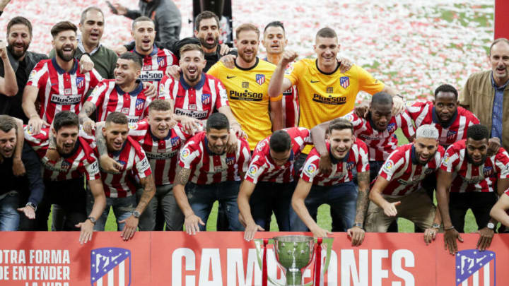MADRID, SPAIN - MAY 23: (L-R) Felipe Monteiro of Atletico Madrid, Stefan Savic of Atletico Madrid, Angel Correa of Atletico Madrid, Lucas Torreira of Atletico Madrid, Mario Hermoso of Atletico Madrid, Kieran Trippier of Atletico Madrid, Hector Herrera of Atletico Madrid, Luis Suarez of Atletico Madrid, Jan Oblak of Atletico Madrid, Renan Lodi of Atletico Madrid, Vitolo Machin of Atletico Madrid, Ivo Grbic of Atletico Madrid, Saul Niguez of Atletico Madrid, Geoffrey Kondogbia of Atletico Madrid, Yannick Carrasco of Atletico Madrid, Moussa Dembele of Atletico Madrid, Thomas Lemar of Atletico Madrid celebrates the championship during the Championship celebration Atletico Madrid at the Estadio Wanda Metropolitano on May 23, 2021 in Madrid Spain (Photo by David S. Bustamante/Soccrates/Getty Images)