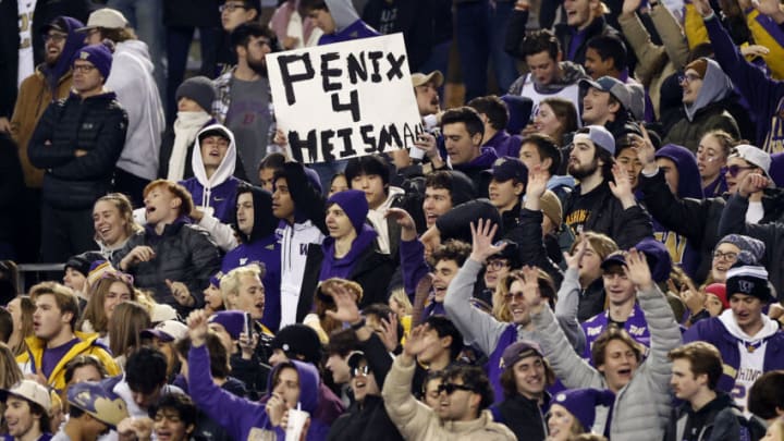 SEATTLE, WASHINGTON - NOVEMBER 19: Fans cheer for Michael Penix Jr. #9 of the Washington Huskies during the third quarter against the Colorado Buffaloes at Husky Stadium on November 19, 2022 in Seattle, Washington. (Photo by Steph Chambers/Getty Images)