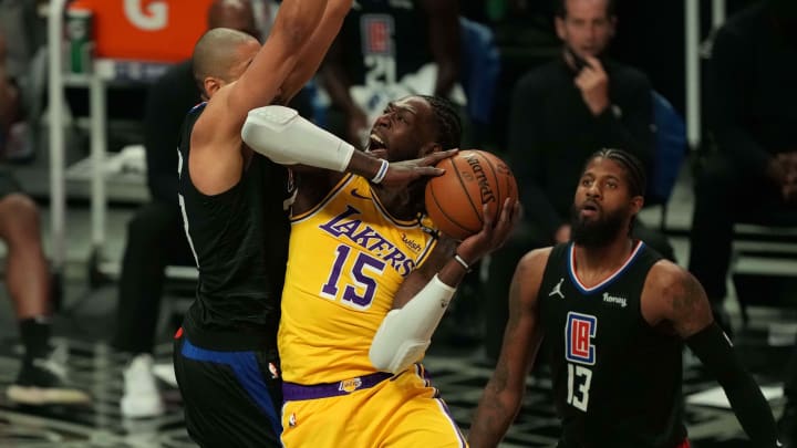 May 6, 2021; Los Angeles, California, USA; Los Angeles Lakers center Montrezl Harrell (15) goes up for a shot while defended by LA Clippers forward Nicolas Batum (33) and guard Paul George (13) in the second half at Staples Center. Mandatory Credit: Kirby Lee-USA TODAY Sports