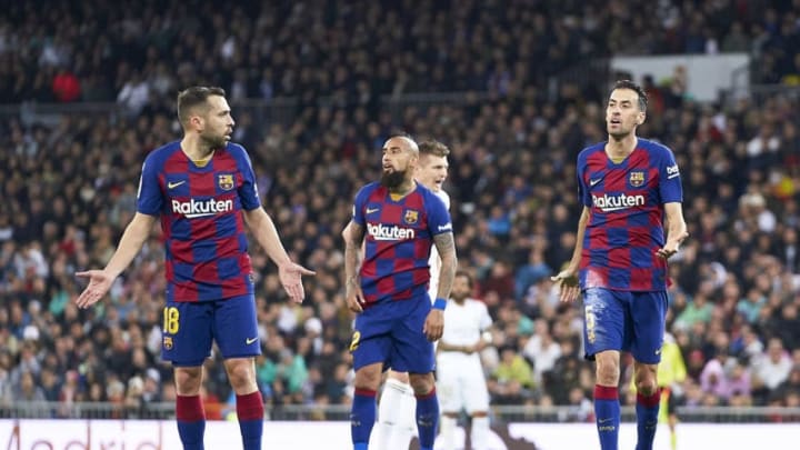 MADRID, SPAIN - MARCH 01: Jordi Alba and Sergio Busquets of FC Barcelona protesting a referee decision during the Liga match between Real Madrid CF and FC Barcelona at Estadio Santiago Bernabeu on March 01, 2020 in Madrid, Spain. (Photo by Mateo Villalba/Quality Sport Images/Getty Images)