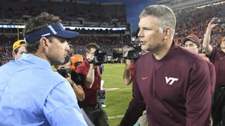 BLACKSBURG, VA - OCTOBER 21: Head coach of the Virginia Tech Hokies Justin Fuente shakes hands with head coach Larry Fedora of the North Carolina Tar Heels following the game at Lane Stadium on October 21, 2017 in Blacksburg, Virginia. (Photo by Michael Shroyer/Getty Images)