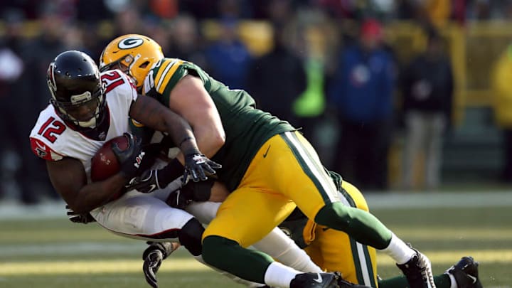 GREEN BAY, WISCONSIN - DECEMBER 09: Mohamed Sanu #12 of the Atlanta Falcons is tackled by Kyler Fackrell #51 of the Green Bay Packers during the first half of a game at Lambeau Field on December 09, 2018 in Green Bay, Wisconsin. (Photo by Dylan Buell/Getty Images)