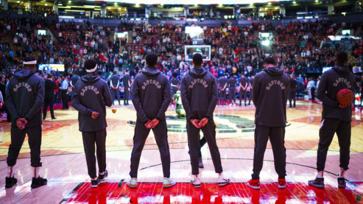 TORONTO, ONTARIO - OCTOBER 13: The Toronto Raptors stand during national anthem before playing the Chicago Bulls in their NBA basketball pre-season game at Scotiabank Arena on October 13, 2019 in Toronto, Canada. NOTE TO USER: User expressly acknowledges and agrees that, by downloading and or using this photograph, User is consenting to the terms and conditions of the Getty Images License Agreement. (Photo by Mark Blinch/Getty Images)