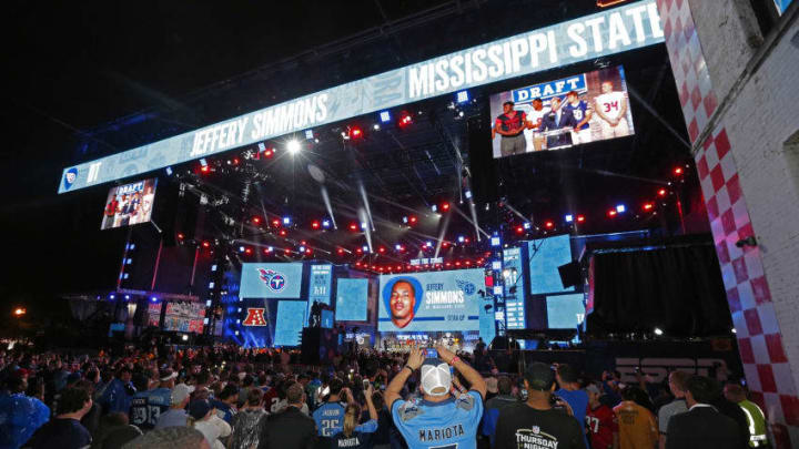 NASHVILLE, TENNESSEE - APRIL 25: Hometown fans of the Tennessee Titans react after their first round pick of Jeffery Simmons is announced on day 1 of the 2019 NFL Draft on April 25, 2019 in Nashville, Tennessee. (Photo by Frederick Breedon/Getty Images)