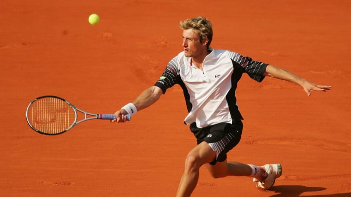 PARIS – MAY 25: Juan Carlos Ferrero returns in his first round match against Tommy Haas of Germany during Day Two of the 2004 French Open Tennis Championship on May 25, 2004 at Roland Garros in Paris, France. (Photo by Clive Mason/Getty Images)