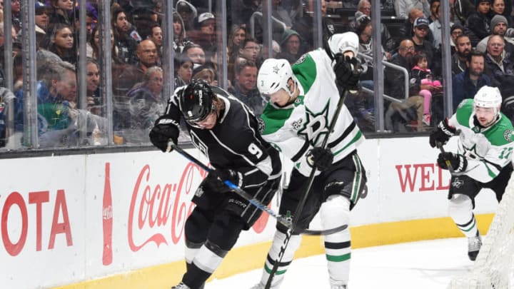 LOS ANGELES, CA - FEBRUARY 22: Adrian Kempe #9 of the Los Angeles Kings battles for the puck against John Klingberg of the Dallas Stars at STAPLES Center on February 22, 2018 in Los Angeles, California. (Photo by Adam Pantozzi/NHLI via Getty Images) *** Local Caption ***