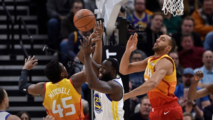 SALT LAKE CITY, UT - DECEMBER 19: Draymond Green #23 of the Golden State Warriors blocks the shot by Donovan Mitchell #45 of the Utah Jazz in the first half of a NBA game at Vivint Smart Home Arena on December 19, 2018 in Salt Lake City, Utah. (Photo by Gene Sweeney Jr./Getty Images)