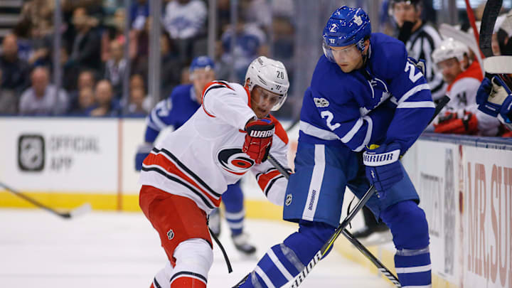 TORONTO, ON – OCTOBER 26: Toronto Maple Leafs defenseman Ron Hainsey (2) with a nifty backhand pass in front of Carolina Hurricanes right wing Sebastian Aho (20). Toronto Maple Leafs VS Carolina Panthers during 1st period action in NHL regular season play at the Air Canada Centre. Toronto Star/Rick Madonik (Rick Madonik/Toronto Star via Getty Images)