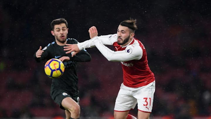 LONDON, ENGLAND - MARCH 01: Sead Kolasinac of Arsenal gets to the ball ahead of Bernardo Silva of Manchester City during the Premier League match between Arsenal and Manchester City at Emirates Stadium on March 1, 2018 in London, England. (Photo by Shaun Botterill/Getty Images)