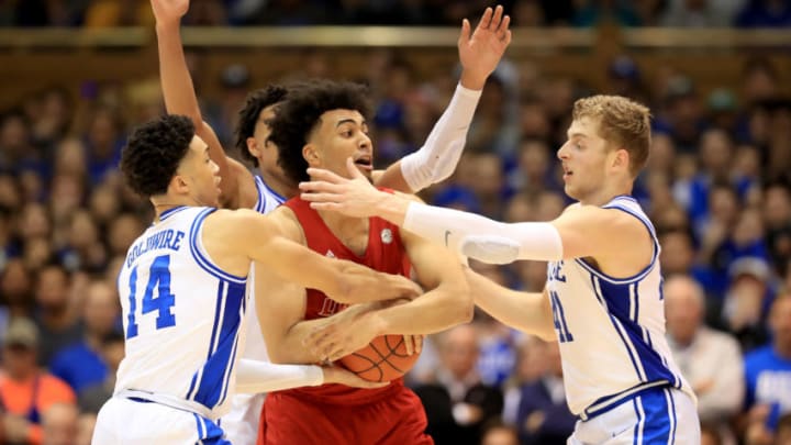 DURHAM, NORTH CAROLINA - JANUARY 18: Jordan Nwora #33 of the Louisville Cardinals is trapped by teammates Jordan Goldwire #14 and Jack White #41 of the Duke Blue Devils during their game at Cameron Indoor Stadium on January 18, 2020 in Durham, North Carolina. (Photo by Streeter Lecka/Getty Images)