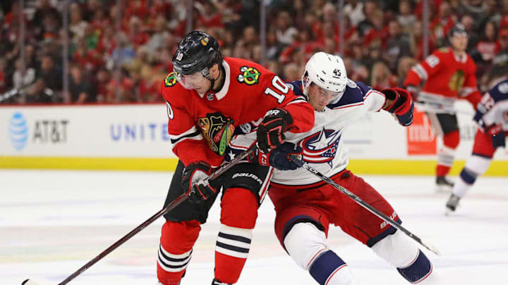 CHICAGO, IL - SEPTEMBER 23: Patrick Sharp #10 of the Chicago Blackhawks is pressured by Lukas Sedlak #45 of the Columbus Blue Jackets as he advances the puck during a preseason game at the United Center on September 23, 2017 in Chicago, Illinois. (Photo by Jonathan Daniel/Getty Images)