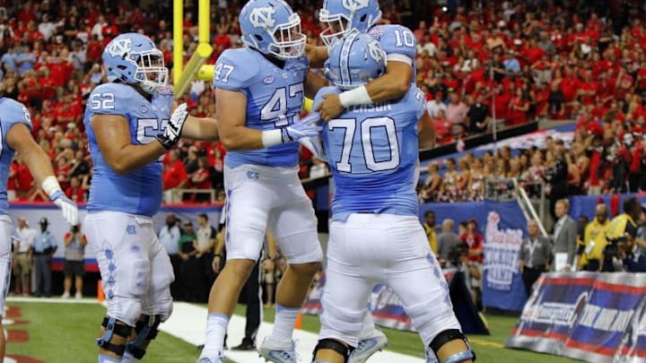 Sep 3, 2016; Atlanta, GA, USA; North Carolina Tar Heels quarterback Mitch Trubisky (10) celebrates a touchdown with teammates against the Georgia Bulldogs during the second quarter of the 2016 Chick-Fil-A Kickoff game at Georgia Dome. Mandatory Credit: Brett Davis-USA TODAY Sports