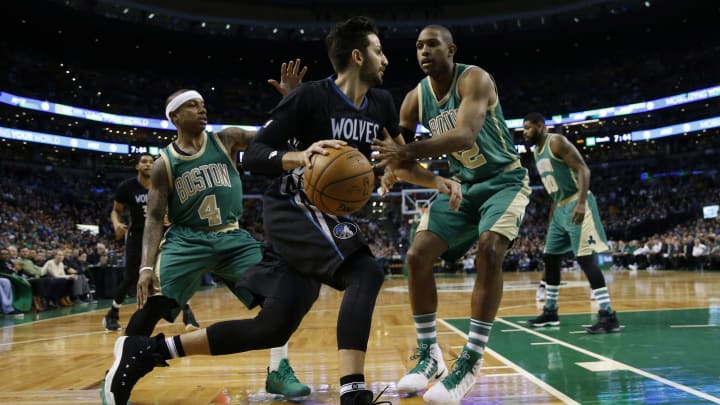 Mar 15, 2017; Boston, MA, USA; Minnesota Timberwolves point guard Ricky Rubio (9) drives against Boston Celtics point guard Isaiah Thomas (4) and center Al Horford (42) during the first quarter at TD Garden. Mandatory Credit: Greg M. Cooper-USA TODAY Sports