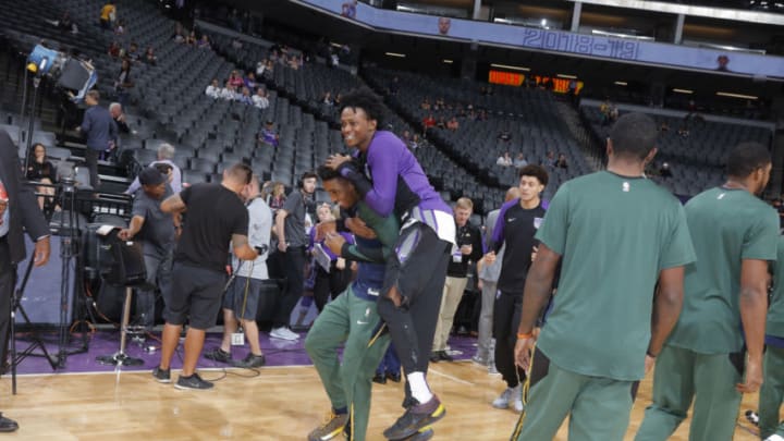 SACRAMENTO, CA - OCTOBER 11: De'Aaron Fox #5 of the Sacramento Kings jokes with Donovan Mitchell #45 of the Utah Jazz prior to the game on October 11, 2018 at Golden 1 Center in Sacramento, California. NOTE TO USER: User expressly acknowledges and agrees that, by downloading and or using this photograph, User is consenting to the terms and conditions of the Getty Images Agreement. Mandatory Copyright Notice: Copyright 2018 NBAE (Photo by Rocky Widner/NBAE via Getty Images)