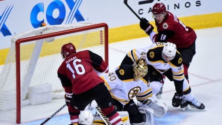 Nov 12, 2016; Glendale, AZ, USA; Arizona Coyotes center Max Domi (16) misses an empty net as Boston Bruins goalie Tuukka Rask (40) is out of position during the second period at Gila River Arena. Mandatory Credit: Matt Kartozian-USA TODAY Sports