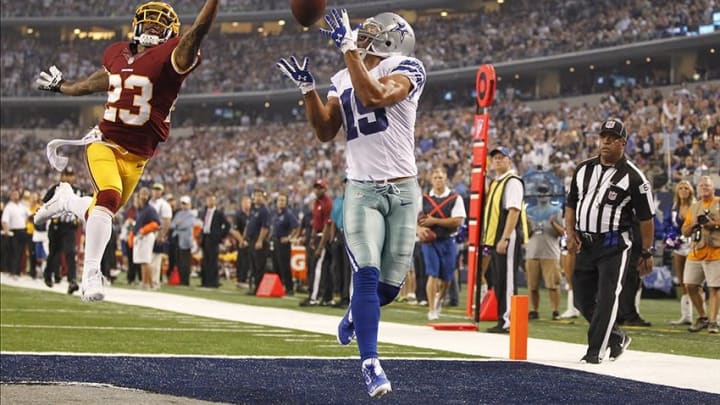 Oct 13, 2013; Arlington, TX, USA; Dallas Cowboys wide receiver Miles Austin (19) cannot catch a pass against Washington Redskins cornerback DeAngelo Hall (23) in the fourth quarter at AT