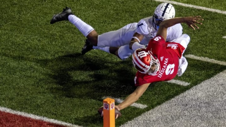 Oct 24, 2020; Bloomington, Indiana, USA; Indiana Hoosiers quarterback Michael Penix Jr. (9) dives with the ball to score a two point conversion and win the game in overtime during the game at Memorial Stadium. The Indiana Hoosiers defeated the Penn State Nittany Lions 36 to 35. Mandatory Credit: Marc Lebryk-USA TODAY Sports