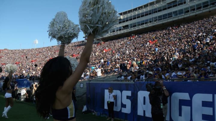 LOS ANGELES, CALIFORNIA - AUGUST 13: A cheerleader performs before the capacity crowd during the game between the Dallas Cowboys and the Los Angeles Rams at the Los Angeles Coliseum during preseason on August 13, 2016 in Los Angeles, California. The Rams won 28-24. (Photo by Stephen Dunn/Getty Images)