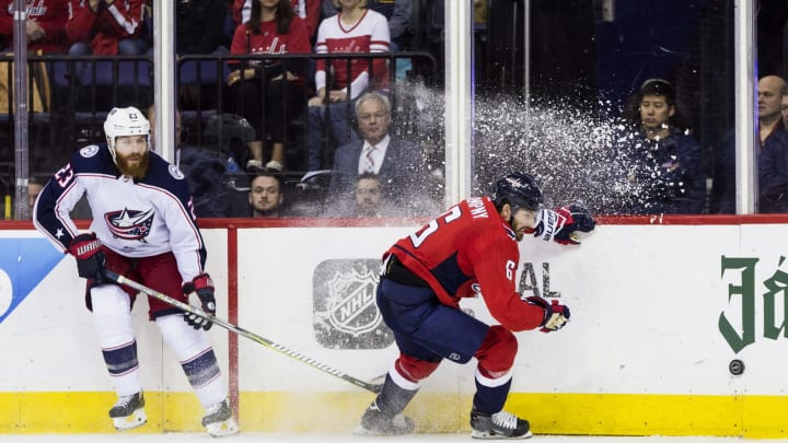 WASHINGTON, DC – APRIL 21: Washington Capitals defenseman Michal Kempny (6) moves the puck along the boards away from Columbus Blue Jackets defenseman Ian Cole (23) during the first round Stanley Cup playoff game 5 between the Washington Capitals and the Columbus Blue Jackets in April 21, 2018, at Capital One Arena, in Washington, D.C. The Capitals defeated the Blue Jackets 4-3 in overtime.(Photo by Tony Quinn/Icon Sportswire via Getty Images)