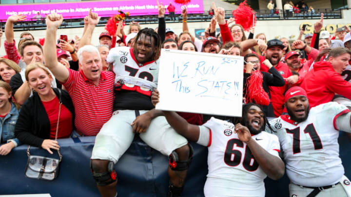 Isaiah Wilson, Andrew Thomas, and Solomon Kindley of the Georgia Bulldogs celebrate following the Georgia Bulldogs (Photo by Carmen Mandato/Getty Images)