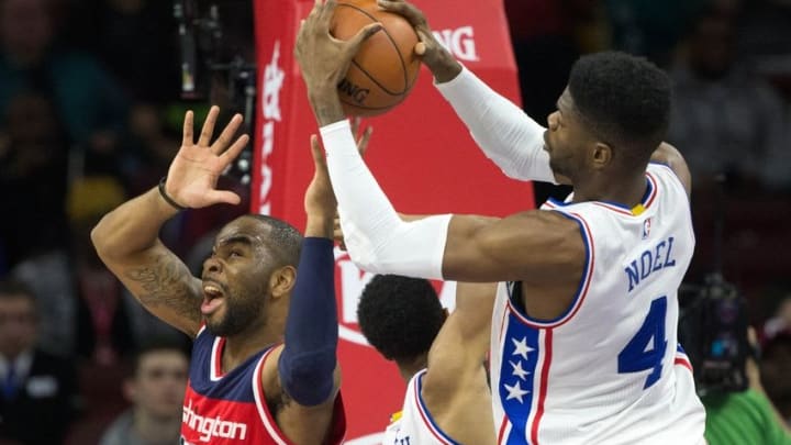 Mar 17, 2016; Philadelphia, PA, USA; Philadelphia 76ers forward Nerlens Noel (4) and Washington Wizards forward Marcus Thornton (15) battle for a rebound during the second quarter at Wells Fargo Center. Mandatory Credit: Bill Streicher-USA TODAY Sports