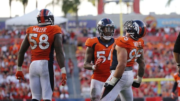 Oct 2, 2016; Tampa, FL, USA; Denver Broncos defensive end Derek Wolfe (95) celebrates with inside linebacker Brandon Marshall (54) and outside linebacker Von Miller (58) after he sacked Tampa Bay Buccaneers quarterback Jameis Winston (3) (not pictured) during the second half at Raymond James Stadium. Mandatory Credit: Kim Klement-USA TODAY Sports