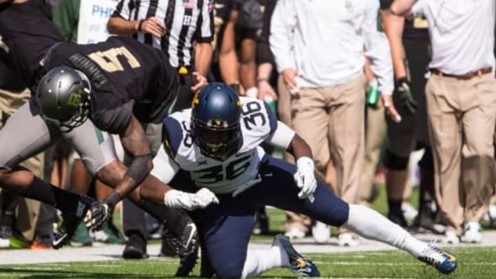 Oct 17, 2015; Waco, TX, USA; West Virginia Mountaineers linebacker Shaq Petteway (36) tackles Baylor Bears wide receiver KD Cannon (9) during the first quarter at McLane Stadium. Mandatory Credit: Jerome Miron-USA TODAY Sports