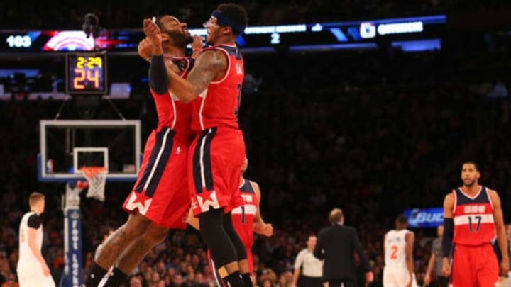 Feb 9, 2016; New York, NY, USA; Washington Wizards guard John Wall (2) and guard Bradley Beal (3) chest bump in celebration during the fourth quarter against the New York Knicks at Madison Square Garden. Washington Wizards won111-108. Mandatory Credit: Anthony Gruppuso-USA TODAY Sports