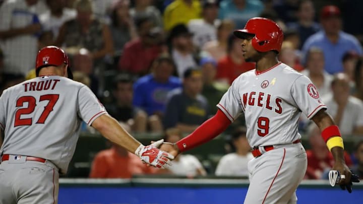 ARLINGTON, TX - SEPTEMBER 1: Mike Trout #27 and Justin Upton #9 of the Los Angeles Angels of Anaheim celebrate after scoring runs against the Texas Rangers during the fifth inning at Globe Life Park in Arlington on September 1, 2017 in Arlington, Texas. (Photo by Ron Jenkins/Getty Images)