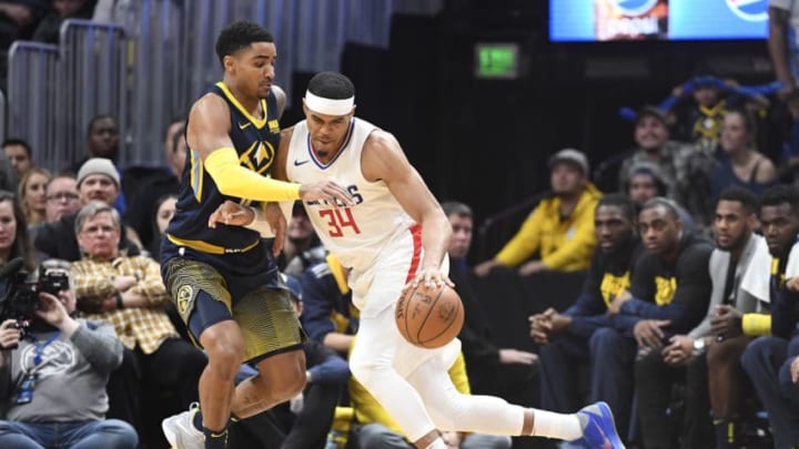 DENVER, CO - FEBRUARY 27: Tobias Harris #34 of the LA Clippers is guarded by Gary Harris #14 of the Denver Nuggets at Pepsi Center on February 27, 2018 in Denver, Colorado. NOTE TO USER: User expressly acknowledges and agrees that, by downloading and or using this photograph, User is consenting to the terms and conditions of the Getty Images License Agreement. (Photo by Justin Tafoya/Getty Images)