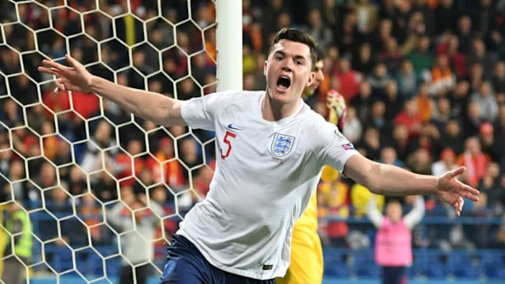 PODGORICA, MONTENEGRO - MARCH 25: Michael Keane of England (5) celebrates as he scores his team's first goal during the 2020 UEFA European Championships Group A qualifying match between Montenegro and England at Podgorica City Stadium on March 25, 2019 in Podgorica, Montenegro. (Photo by Michael Regan/Getty Images)
