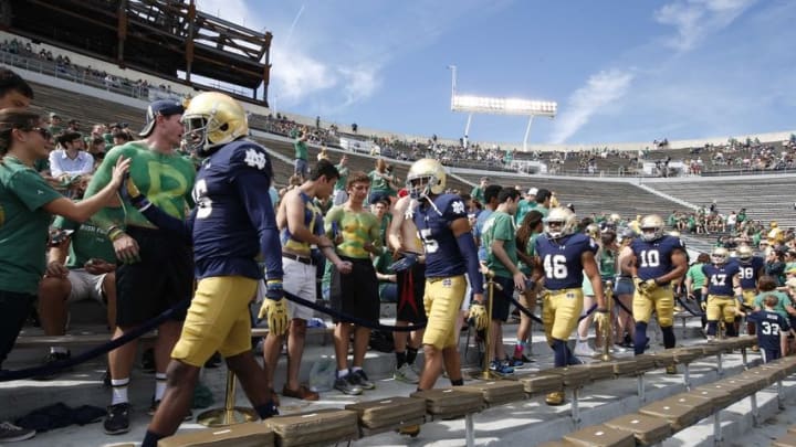 Sep 26, 2015; South Bend, IN, USA; Notre Dame Fighting Irish players walk through the student section before warming up against the Massachusetts Minutemen at Notre Dame Stadium. Mandatory Credit: Brian Spurlock-USA TODAY Sports